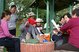 People singing in the Expo gardens