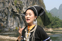 Zhuang songbird serenading Peter on board Li River cruiseboat