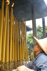 Burning candles in a Buddhist temple in Seven Star Park, Guilin