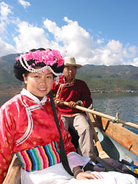 Lillian in Mosuo costume on boat, Lugu Lake