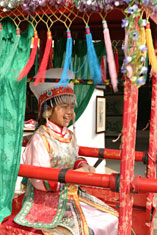 Girl wearing bridal costume in wedding sedan, Tongli