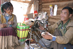 Yi village man mending a shoe, northeast Yunnan